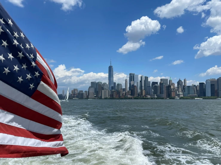 an american flag is fluttering in the wind