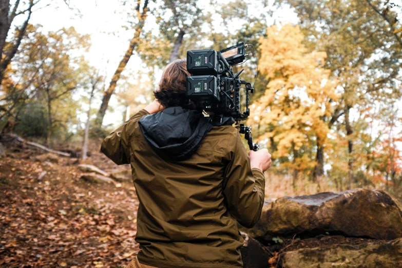 a man that is standing in the woods