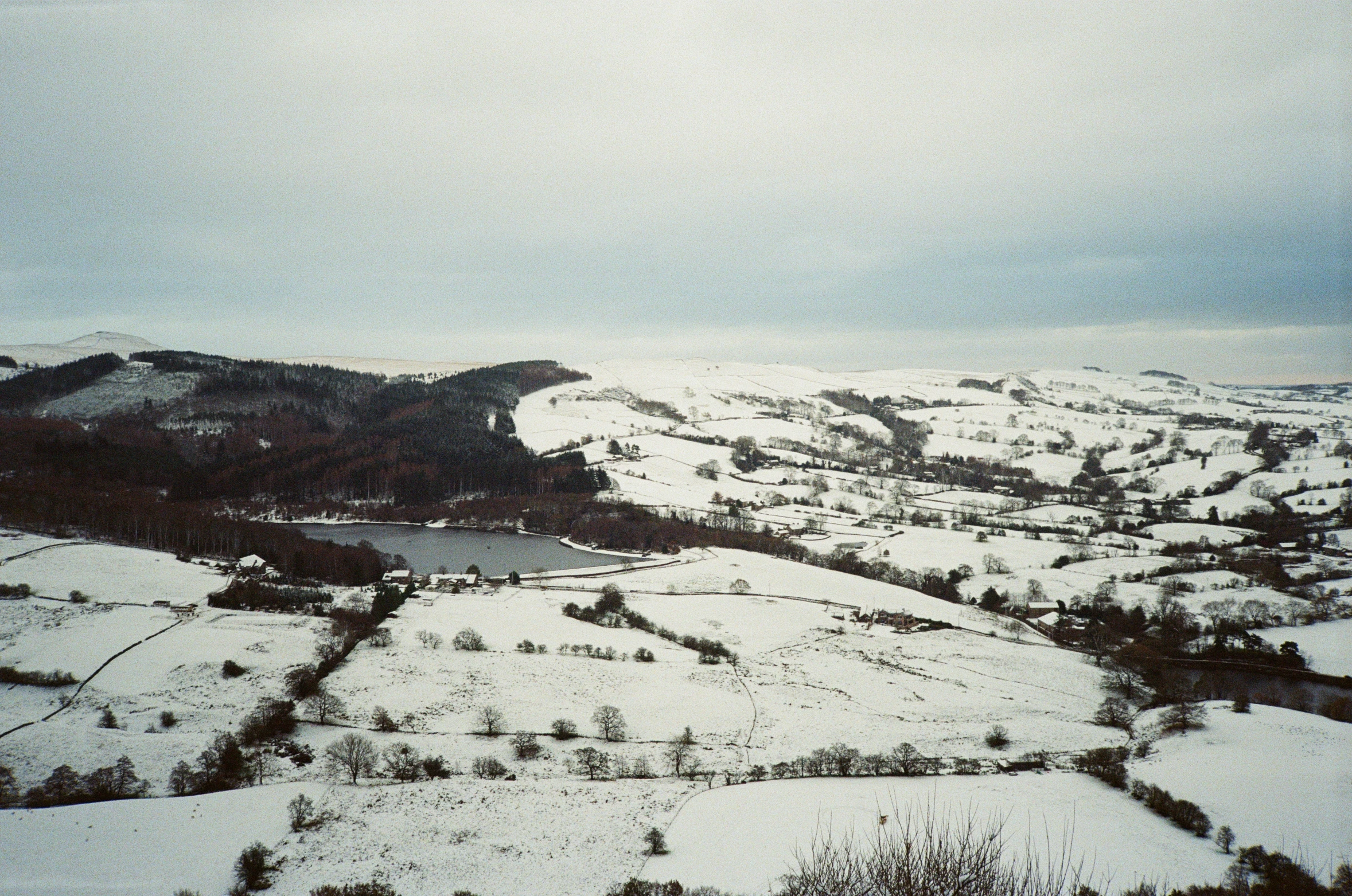 the landscape of an outside town with a very large amount of snow