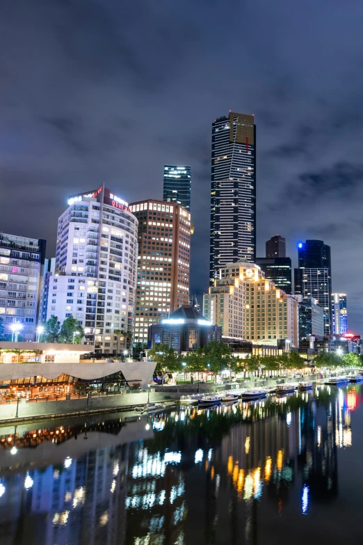 a view of a night skyline of several big buildings in the city