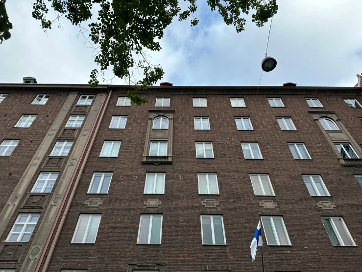 a tall building with lots of windows on top