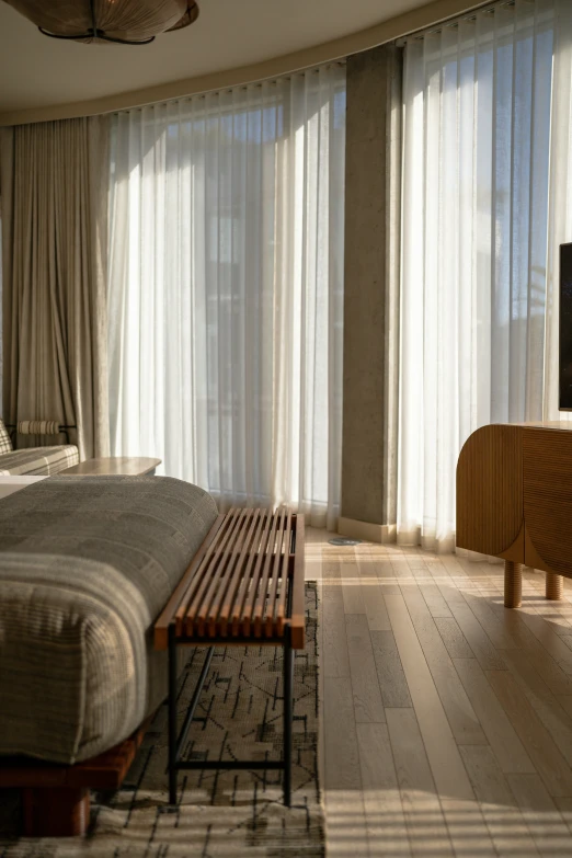 a bedroom with sheer ds and bed