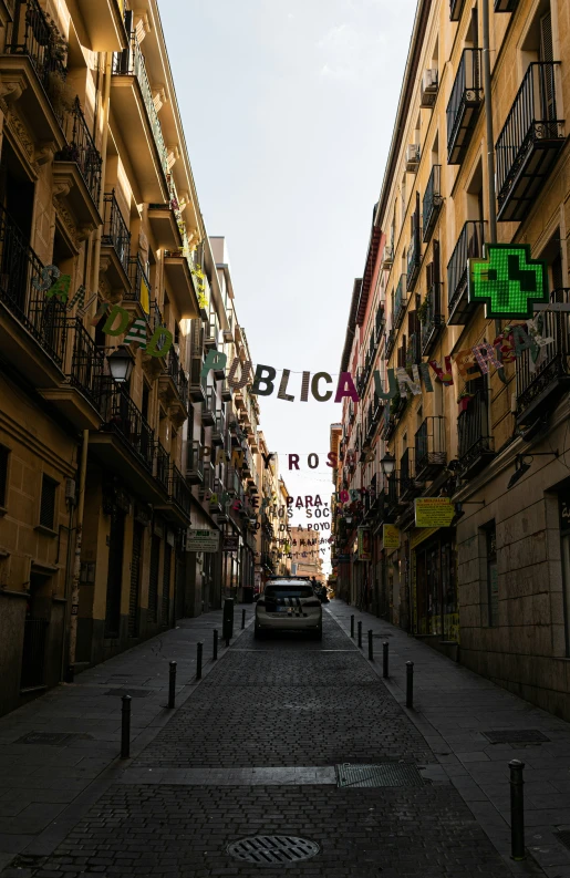 a narrow street between two buildings is shown