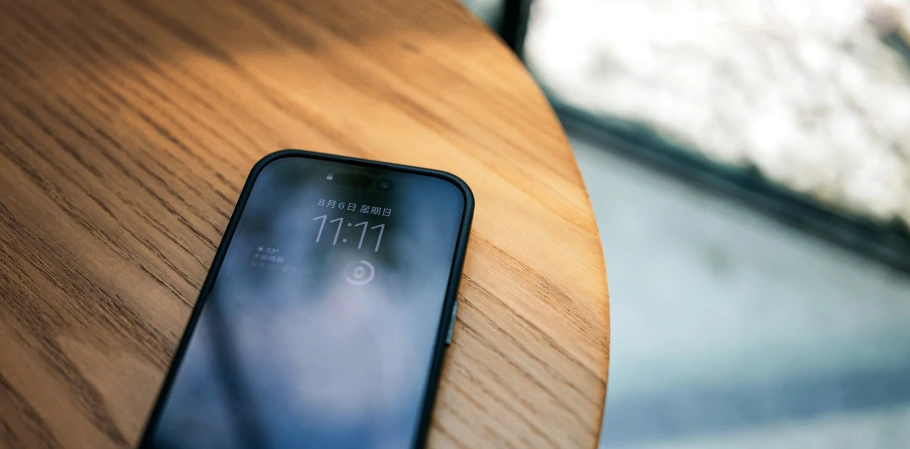 an iphone resting on a table top