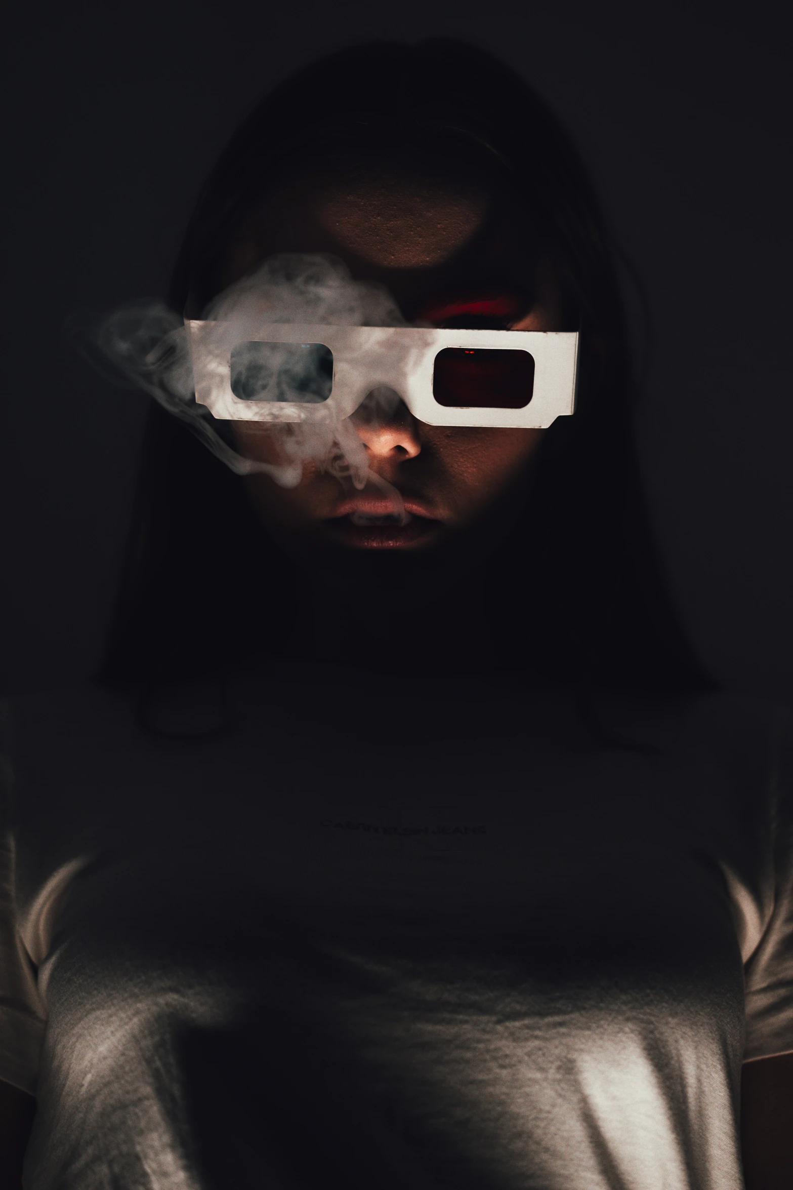 a girl is seen in front of a poster wearing 3d glasses