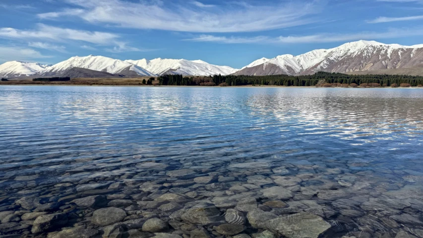 the mountain ranges are covered with snow in a clear landscape