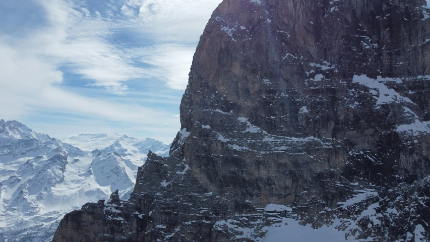 the view from the top of a mountain with snow on it