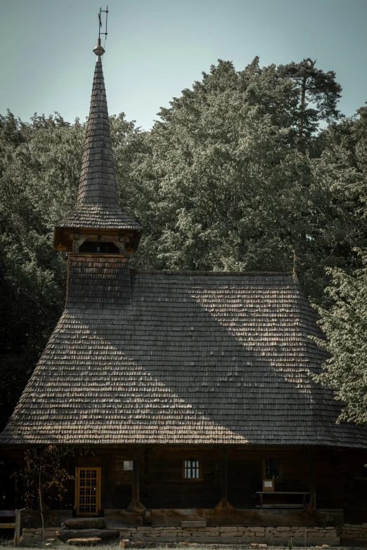 a brown building has a tower and has windows