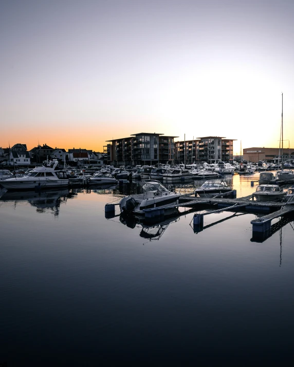 the marina is busy with boats and a lot of buildings