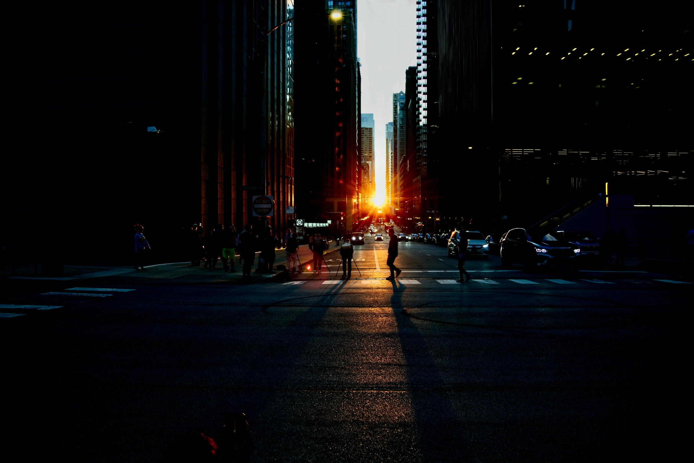 people are walking on the street at night