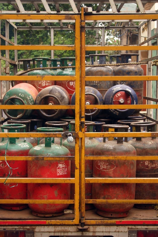 a large truck loaded with gas bottles in a storage area