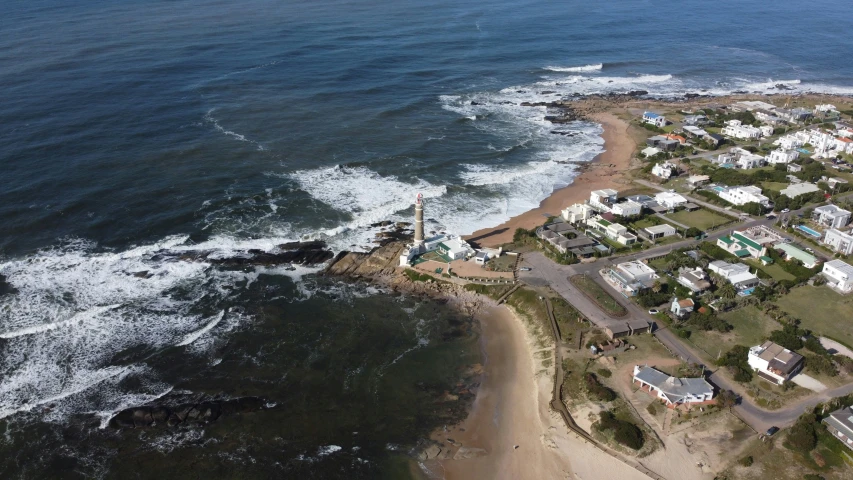 an aerial view of the ocean and houses with many windows