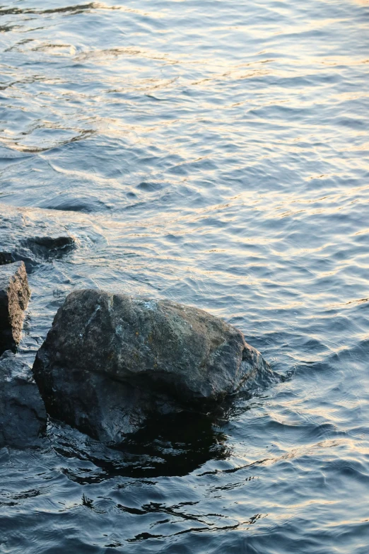 two rocks with water in front of them