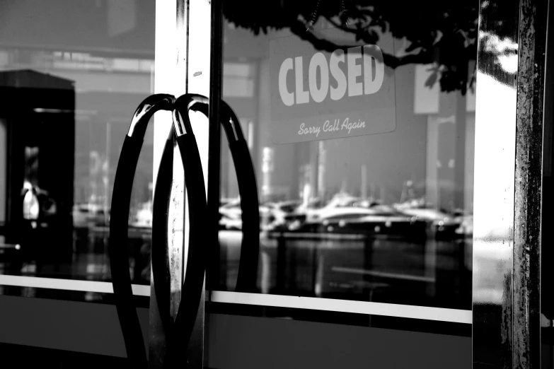 a closed shop window on a street corner