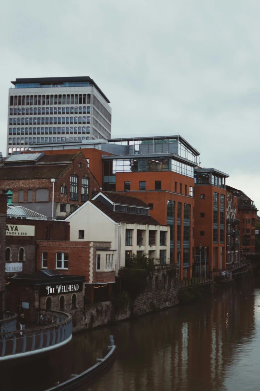 the buildings are surrounded by water and brick along side of each other