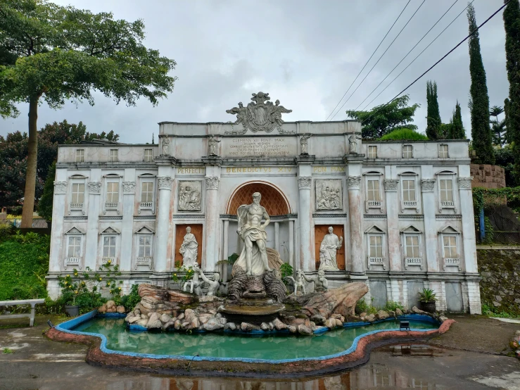 a fountain has a statue on it