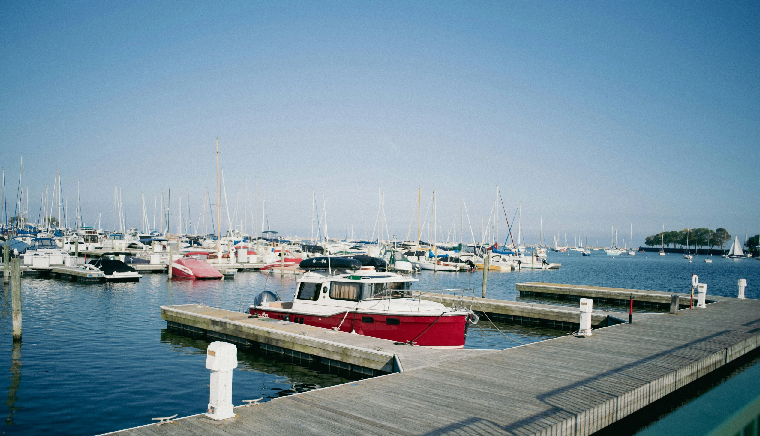 small boats docked at the marina on a clear day