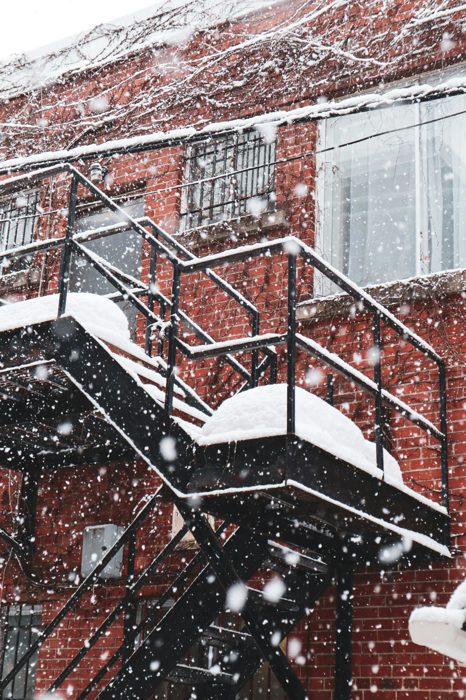 a stairway outside of a building covered in snow