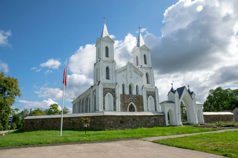 a white church on the side of a street