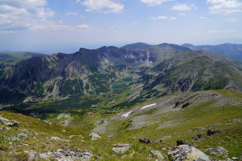 a view of mountains that are high in the air