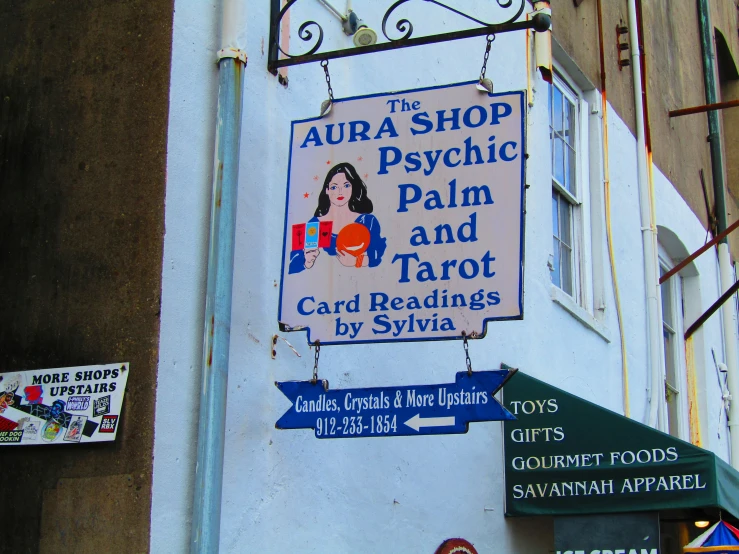 a sign that says aura shop psychic and tarot readings