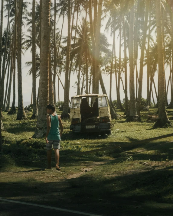 a person walking on the path near a golf cart