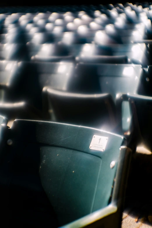 an empty stadium seat is shown at the end of the field