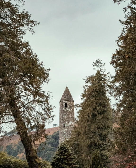 an old, rundown church is surrounded by trees