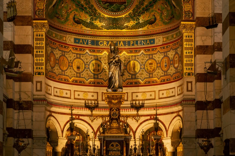 the interior of a cathedral with gold designs