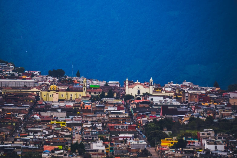 a picture of some buildings that are overlooking the ocean