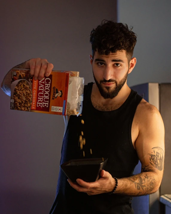 man pouring brownies into bowl with a bag