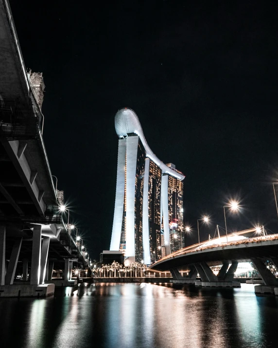 buildings are lit up against the night sky