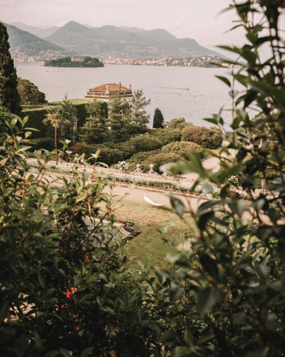 a scenic view of a house and lake