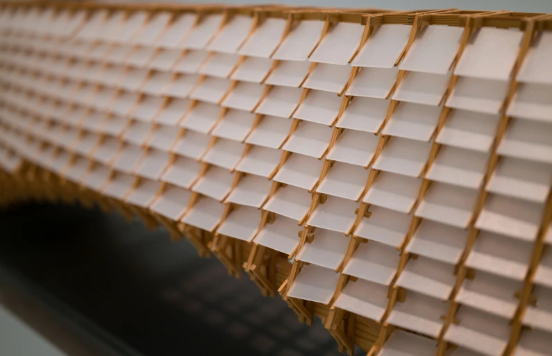 a long section of tan woven material that is being folded