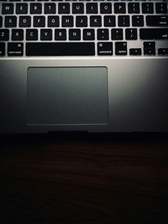 a view of a laptop from above looking at the keyboard and mouse