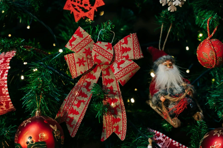 a very bright christmas tree with ornaments on it