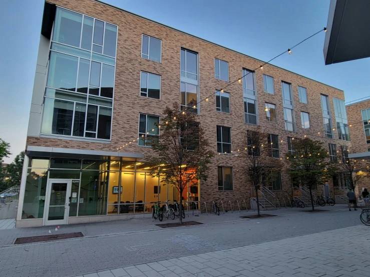 an apartment building with bicycles parked outside