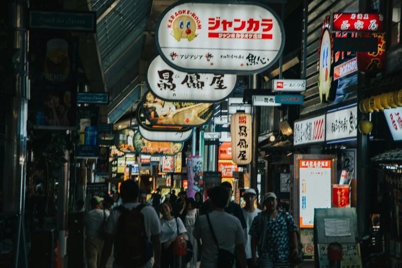 several people walking along a busy city street