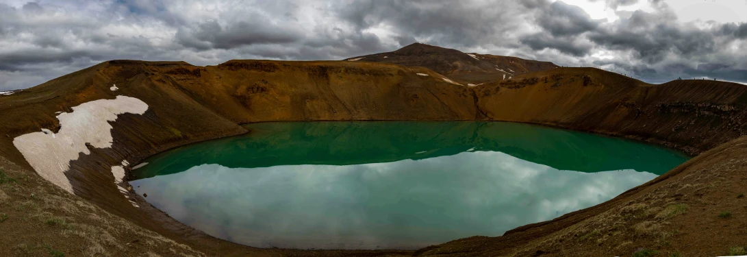 the green water of an old crater is very clear