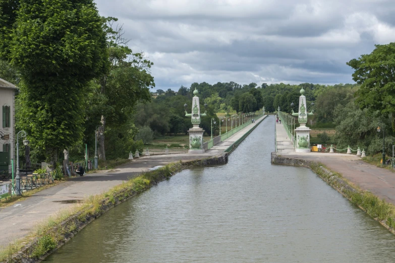 a view from a bridge looking down at a canal