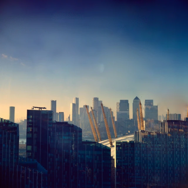 an airplane is flying low over the city