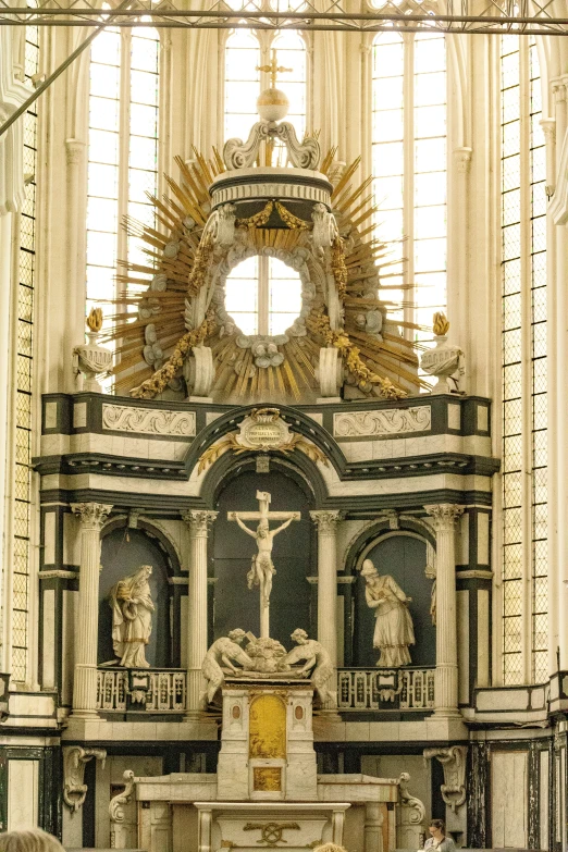 an ornate, elaborate cathedral altar in the middle of a church