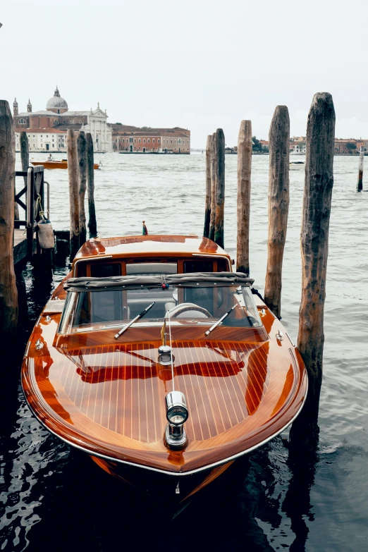 an old model boat parked in the middle of a pier