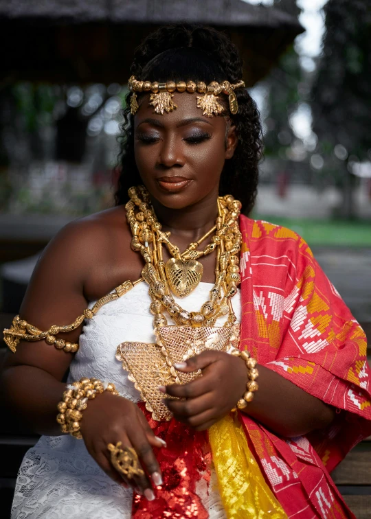 a woman in traditional dress with her jewelry on