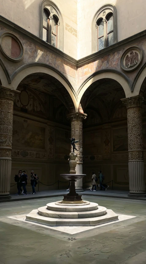 a statue in a room that is built in stone