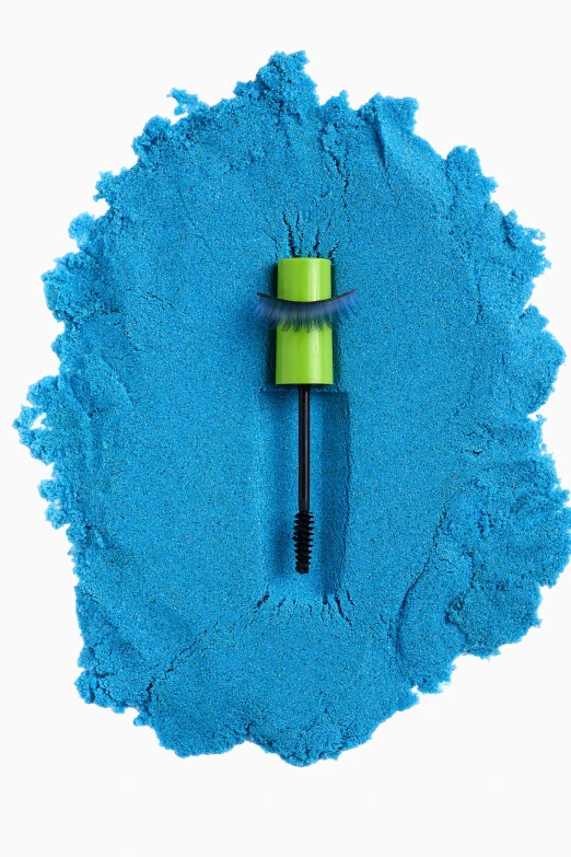 a blue brush with an extended handle against a white background