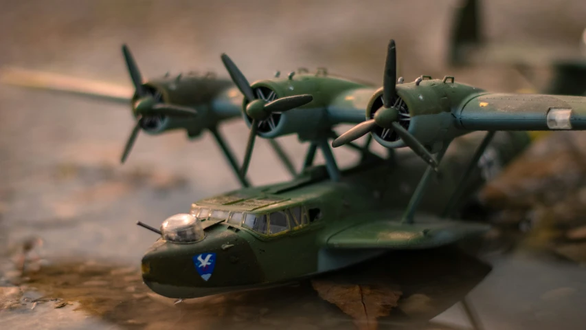 a close up image of three green toy airplanes