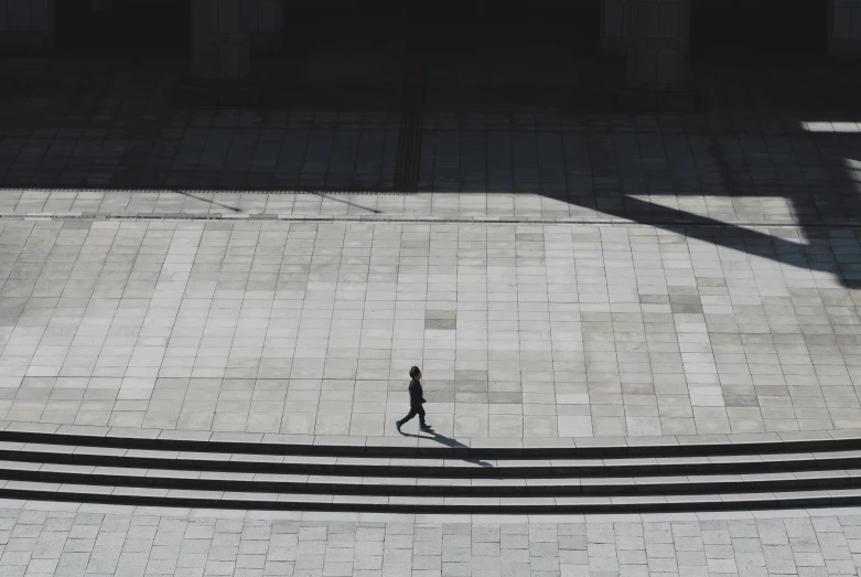 a person walking down some steps with a cellphone