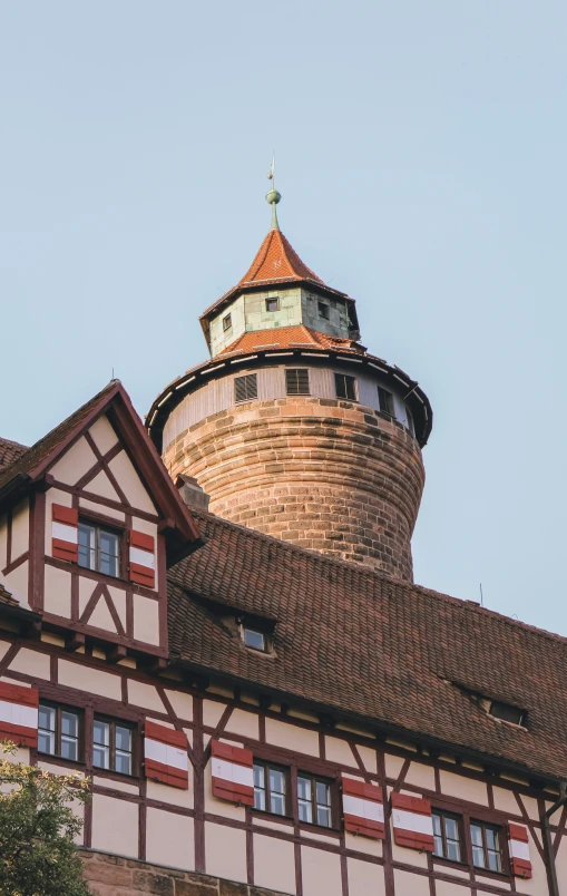 some type of brown and white house with a clock on top