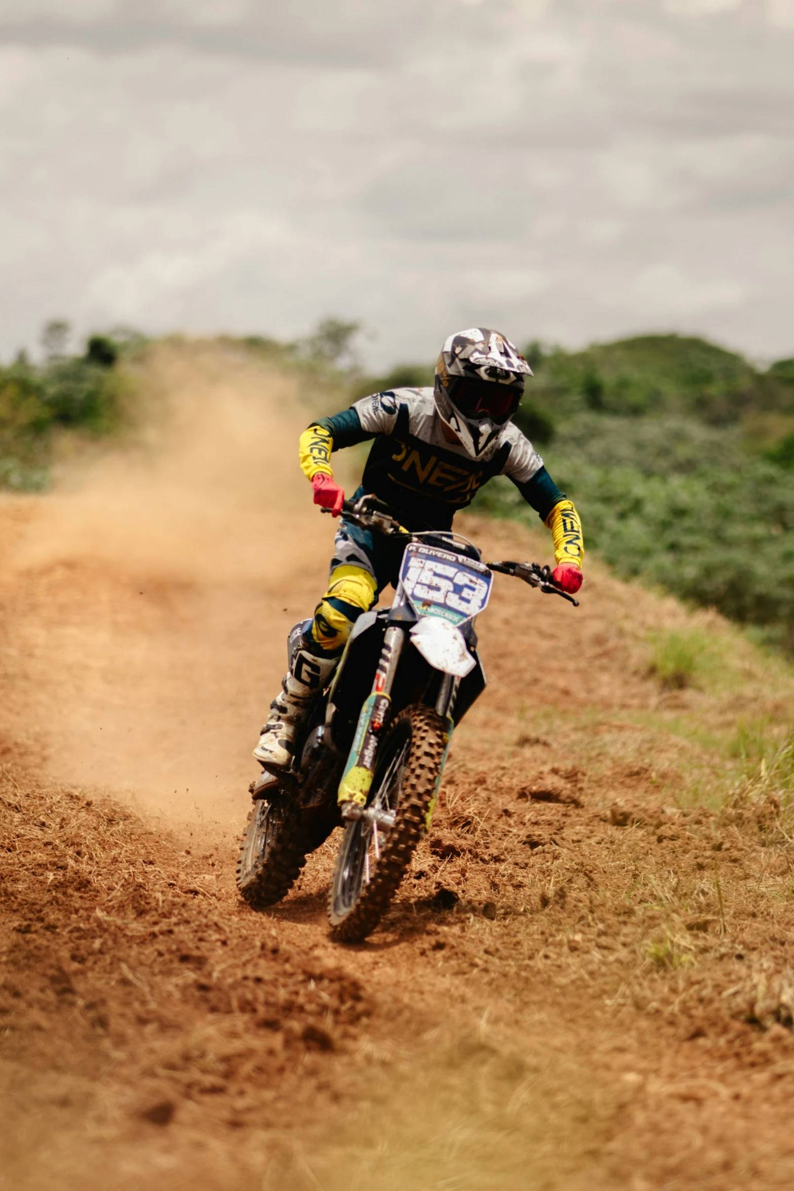 a person on a dirt bike in the dirt